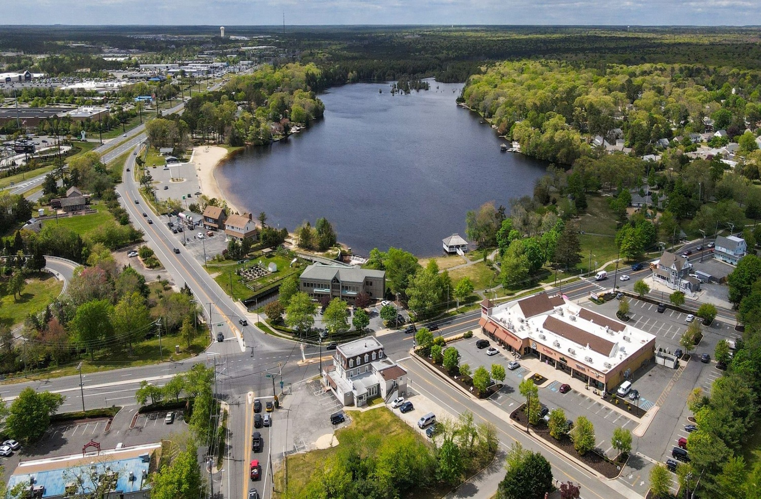 Aerial view of Toms River waterfront area with river, roads, and nearby buildings